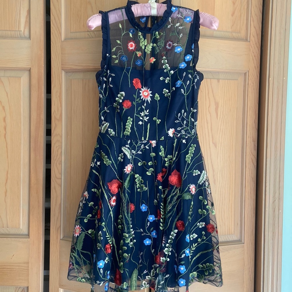 Navy City Studio with floral appliqué overlay